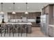 Spacious kitchen featuring a large island and stainless steel appliances at 4360 Sunset Preserve Blvd, Orlando, FL 32820
