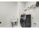 Laundry room with washer, dryer, and utility sink at 4360 Sunset Preserve Blvd, Orlando, FL 32820