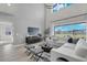 Spacious living room with large windows and backyard access at 4360 Sunset Preserve Blvd, Orlando, FL 32820