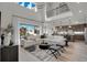 Spacious living room with high ceilings, large windows, and a cozy seating area at 4360 Sunset Preserve Blvd, Orlando, FL 32820
