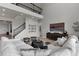 Two-story living room with sectional sofa, large windows, and high ceilings at 4360 Sunset Preserve Blvd, Orlando, FL 32820