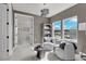 Bright sitting area with two armchairs and a view at 4360 Sunset Preserve Blvd, Orlando, FL 32820