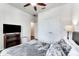 Well-lit bedroom with a queen-size bed and direct access to the bathroom at 4973 Pall Mall W St, Kissimmee, FL 34758