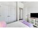 Bedroom with a queen bed, TV, and built-in closet at 4973 Pall Mall W St, Kissimmee, FL 34758
