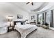 Spacious Primary bedroom featuring a large bed and plenty of natural light at 4973 Pall Mall W St, Kissimmee, FL 34758