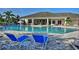 Resort-style community pool with plenty of seating at 4973 Pall Mall W St, Kissimmee, FL 34758