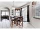 Breakfast nook with a wooden table and four chairs at 4973 Pall Mall W St, Kissimmee, FL 34758