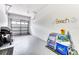 Garage with space for storage and outdoor items at 4973 Pall Mall W St, Kissimmee, FL 34758