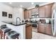 Kitchen with granite countertops and stainless steel appliances at 4973 Pall Mall W St, Kissimmee, FL 34758