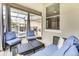 Covered lanai with seating area and pool view at 4973 Pall Mall W St, Kissimmee, FL 34758