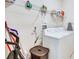 Laundry room with washer, dryer, and shelving at 4973 Pall Mall W St, Kissimmee, FL 34758