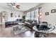 Spacious living room with hardwood floors, sectional sofa, and large TV at 4973 Pall Mall W St, Kissimmee, FL 34758