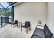 Pool area with seating and additional patio furniture at 4973 Pall Mall W St, Kissimmee, FL 34758