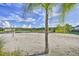 Beach volleyball court with sand and palm trees at 4973 Pall Mall W St, Kissimmee, FL 34758