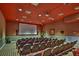 Community theater room with many seats and large screen at 4973 Pall Mall W St, Kissimmee, FL 34758