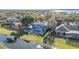 Stunning waterfront home with pool, balconies, lush landscaping, and private boat dock, offering luxurious lakeside living at 6025 Lady Bet Dr, Orlando, FL 32819