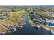 Aerial view of waterfront home with private dock and lush landscaping at 6025 Lady Bet Dr, Orlando, FL 32819
