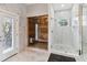 A modern bathroom features a glass shower, a separate sauna, and marble walls at 6025 Lady Bet Dr, Orlando, FL 32819