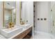 Elegant bathroom with double sinks, marble vanity, and a glass-enclosed shower at 6025 Lady Bet Dr, Orlando, FL 32819