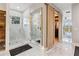 This bathroom offers modern finishes, marble walls, a walk-in shower and ensuite closet at 6025 Lady Bet Dr, Orlando, FL 32819