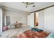 This bedroom features light wood floors, a desk and a sliding barn door to the bath at 6025 Lady Bet Dr, Orlando, FL 32819