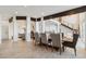 Open concept dining room with wooden table and view to kitchen at 6025 Lady Bet Dr, Orlando, FL 32819