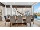 Bright dining room featuring a large wooden table and modern chairs at 6025 Lady Bet Dr, Orlando, FL 32819