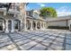 Spacious front patio with decorative columns and a basketball hoop at 6025 Lady Bet Dr, Orlando, FL 32819