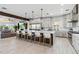 Open-concept kitchen with a large island flowing into a cozy living area at 6025 Lady Bet Dr, Orlando, FL 32819