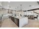 Expansive open-concept kitchen with an island connecting the dining and living spaces at 6025 Lady Bet Dr, Orlando, FL 32819