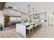 Modern kitchen with large island, wine cooler, and stainless steel appliances at 6025 Lady Bet Dr, Orlando, FL 32819