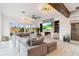 Spacious living area with sectional sofa, fireplace, and large screen TV at 6025 Lady Bet Dr, Orlando, FL 32819