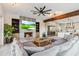 Comfortable living space with modern fireplace, built-in shelving, and an open kitchen at 6025 Lady Bet Dr, Orlando, FL 32819