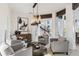 Bright living room features modern decor, stylish lighting, and an open staircase at 6025 Lady Bet Dr, Orlando, FL 32819