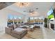Relaxing living room with sectional sofa, fireplace, and access to outdoor space at 6025 Lady Bet Dr, Orlando, FL 32819