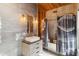The main bathroom is finished with modern tile, fixtures and artistic shower curtain at 6025 Lady Bet Dr, Orlando, FL 32819