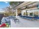 Expansive covered patio with stylish seating, dining area, ceiling fans, and an outdoor television at 6025 Lady Bet Dr, Orlando, FL 32819