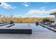 Stunning infinity pool with waterfront views and lounge chairs, perfect for relaxation and entertaining at 6025 Lady Bet Dr, Orlando, FL 32819
