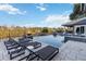 Expansive pool area with multiple lounge chairs at 6025 Lady Bet Dr, Orlando, FL 32819
