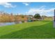 Large grassy yard with private dock and boat lift on the canal at 6025 Lady Bet Dr, Orlando, FL 32819