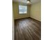 Spacious bedroom with hardwood floors and ceiling fan at 860 N Orange Ave # 118, Orlando, FL 32801