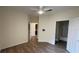 Bedroom with wood-look floors and access to bathroom at 860 N Orange Ave # 118, Orlando, FL 32801