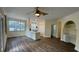 Open concept dining area with kitchen island and hardwood floors at 860 N Orange Ave # 118, Orlando, FL 32801