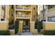 Building exterior with gated entrance and landscaping at 860 N Orange Ave # 118, Orlando, FL 32801