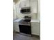 Modern kitchen with stainless steel appliances and white cabinets at 860 N Orange Ave # 118, Orlando, FL 32801