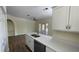 Kitchen with white cabinets, quartz countertops, and stainless steel appliances at 860 N Orange Ave # 118, Orlando, FL 32801