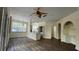 Open living room with kitchen island, new flooring, and neutral colors at 860 N Orange Ave # 118, Orlando, FL 32801