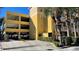 Building with parking garage and gated entry at 860 N Orange Ave # 118, Orlando, FL 32801