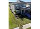 Two-story home with gray exterior, landscaping, and driveway at 8900 Takeaway Way, Davenport, FL 33896