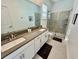 Modern bathroom with double vanity and walk-in shower at 8900 Takeaway Way, Davenport, FL 33896